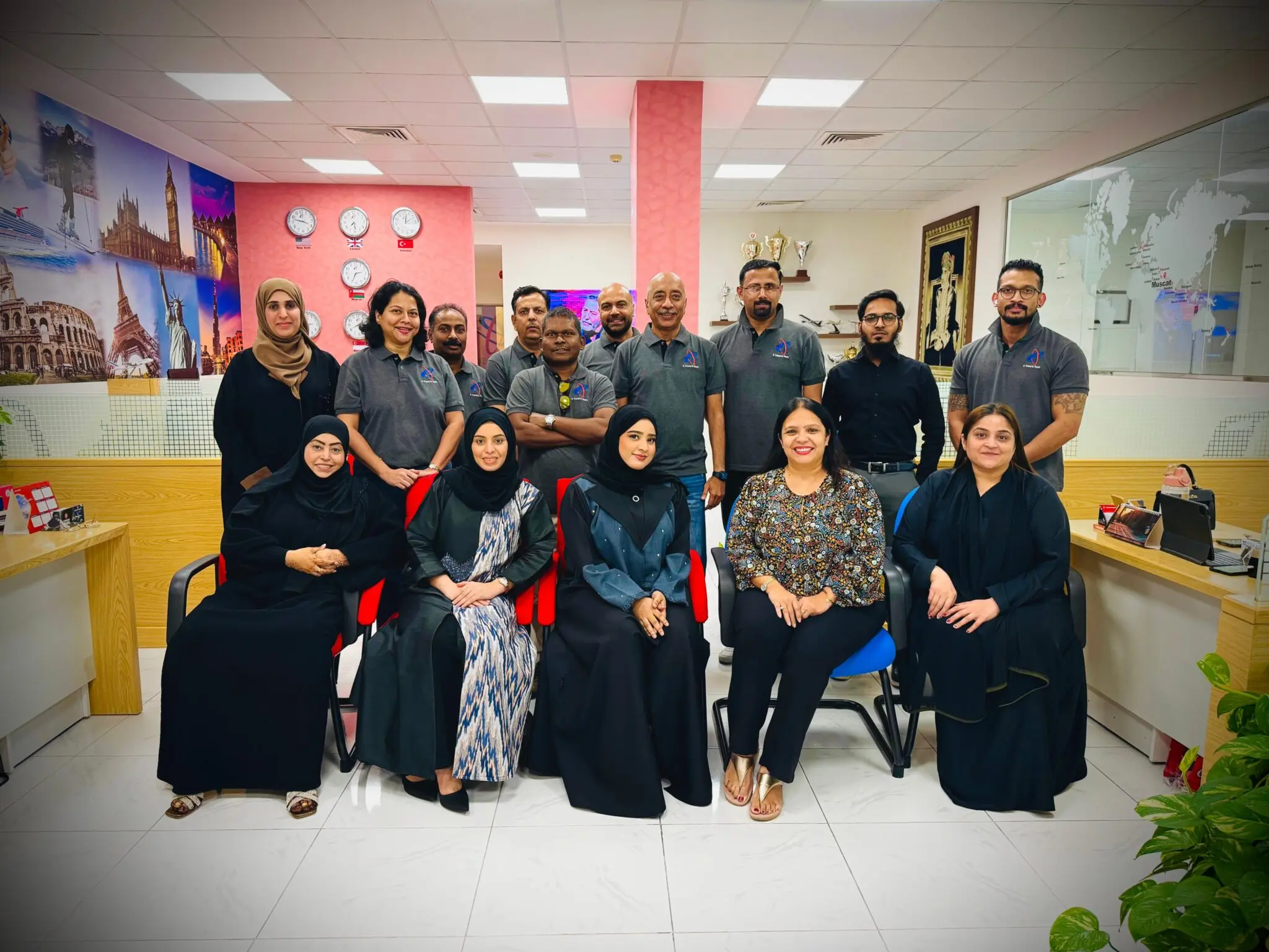 Easy Travel & Tourism team gathered in their Muscat office